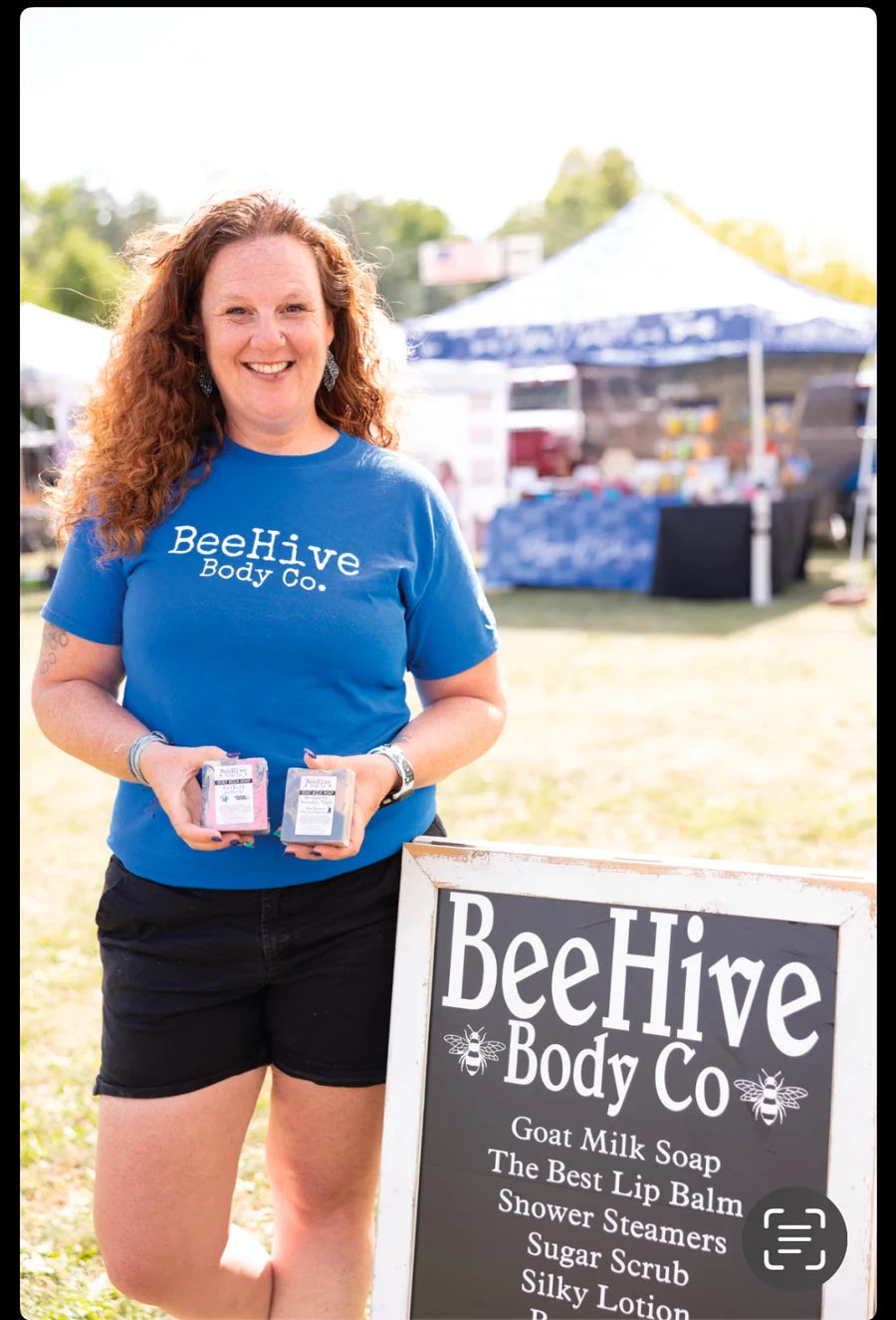 Mary Hobbs, founder of BeeHive Body Co., at a farmers market with her handmade soap